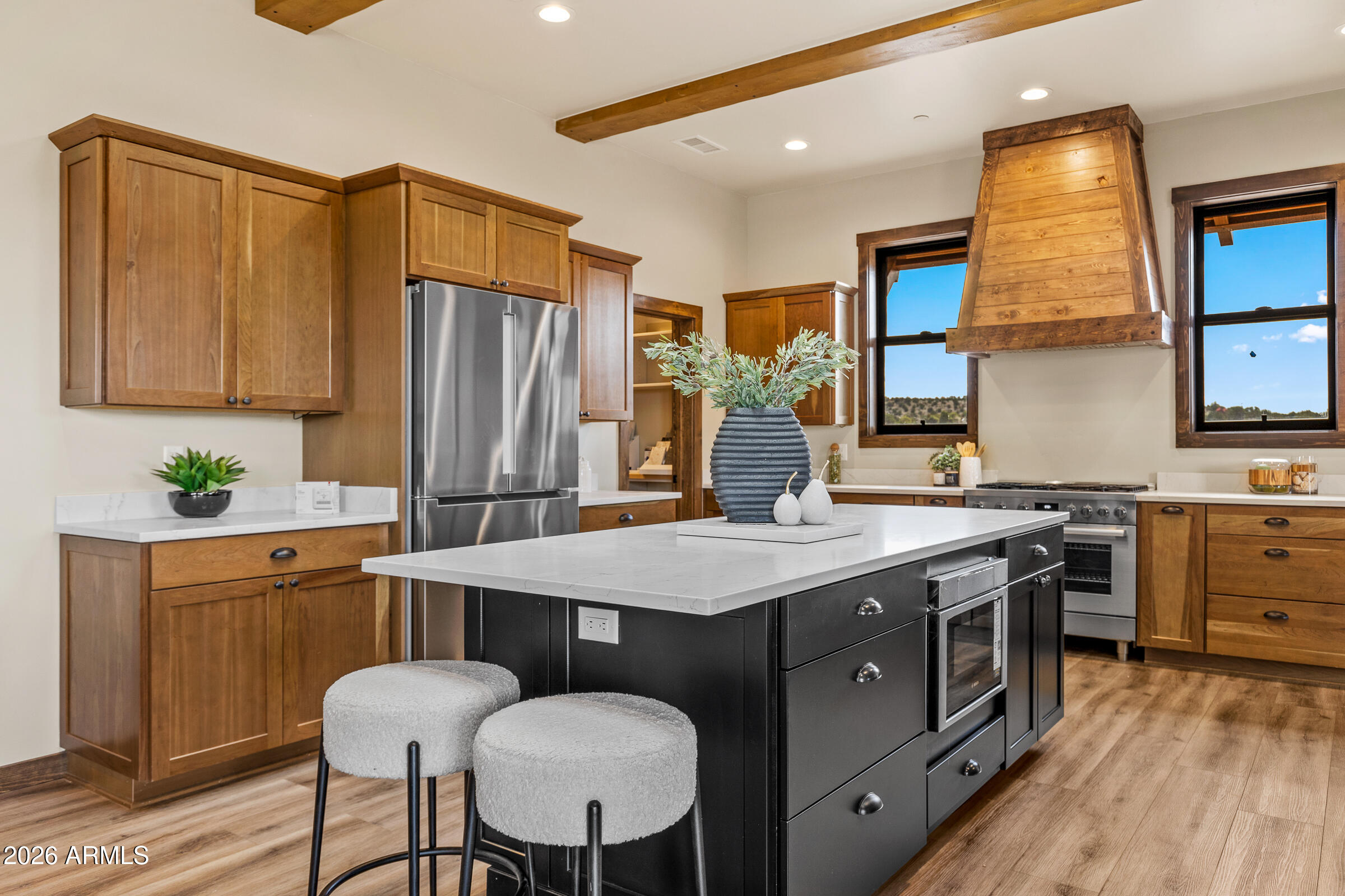 6570 Meadows Lane Flagstaff, AZ 86004 - Photo 16 of 66 a kitchen with a stove a sink and a refrigerator