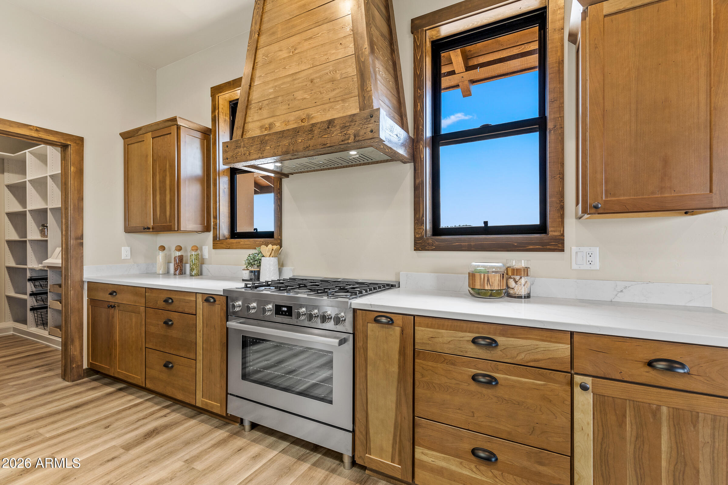 6570 Meadows Lane Flagstaff, AZ 86004 - Photo 17 of 66 a kitchen with stainless steel appliances granite countertop a sink stove and cabinets
