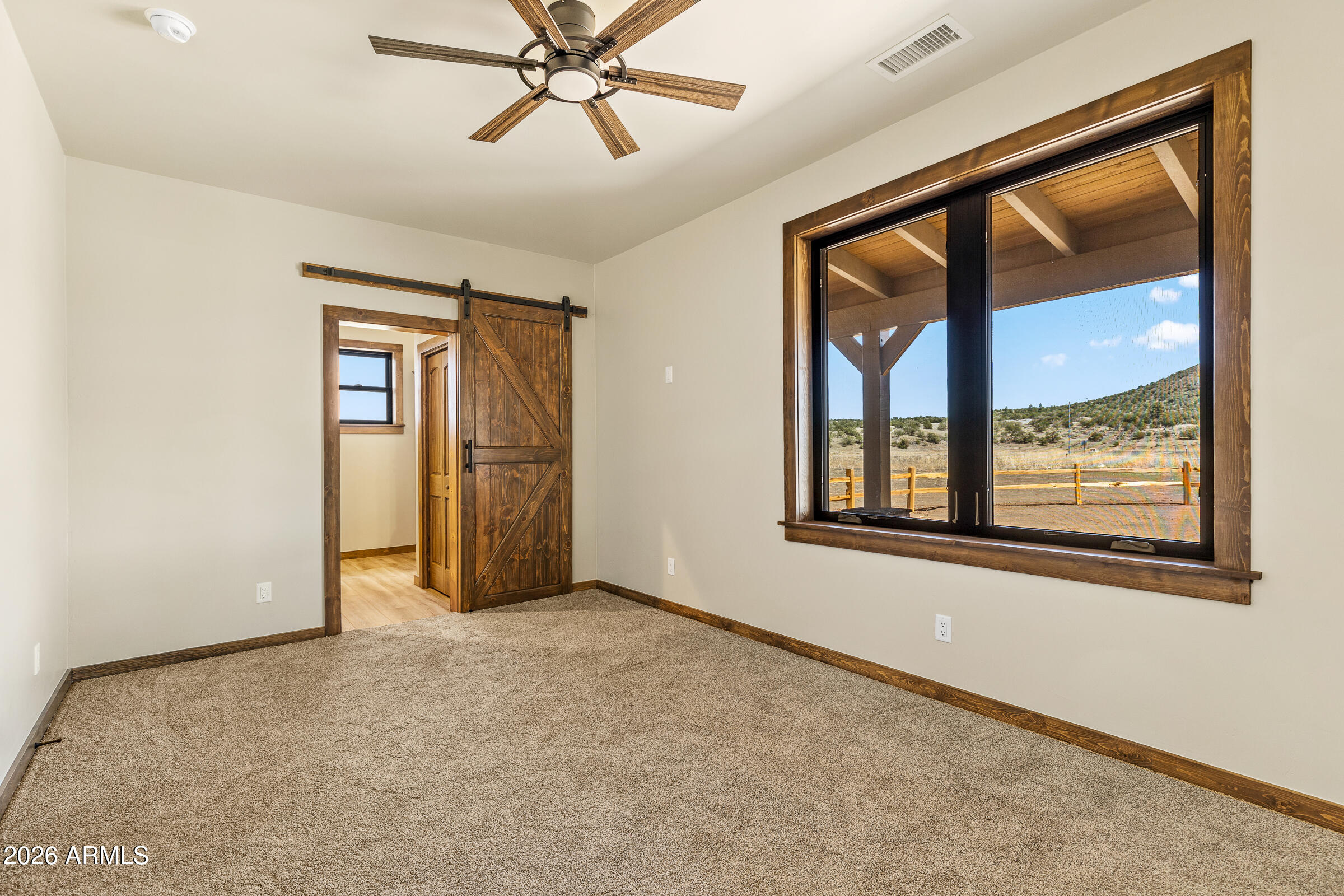 6570 Meadows Lane Flagstaff, AZ 86004 - Photo 31 of 66 an empty room with a window