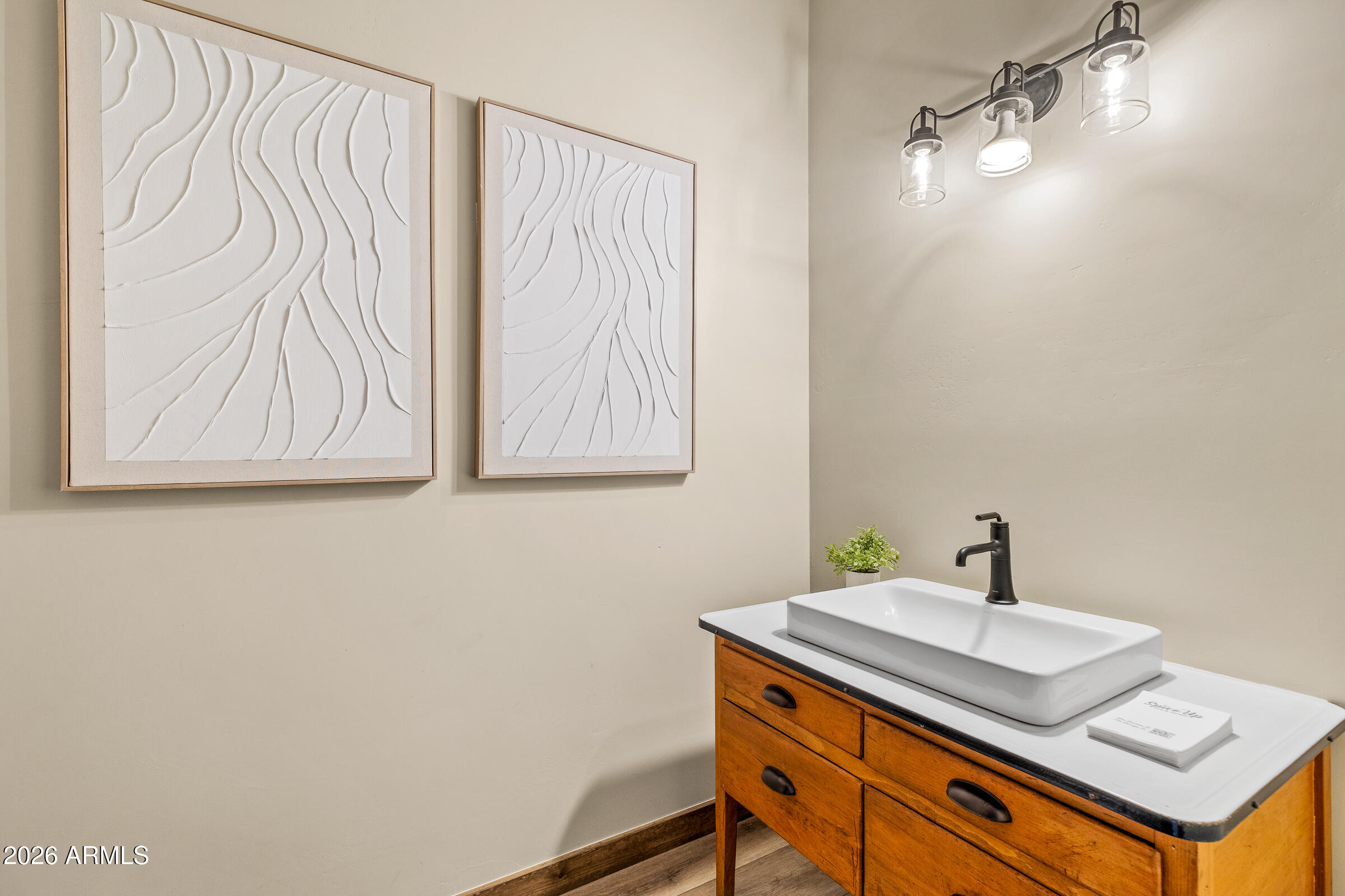 6570 Meadows Lane Flagstaff, AZ 86004 - Photo 35 of 66 a bathroom with a sink a vanity and a mirror