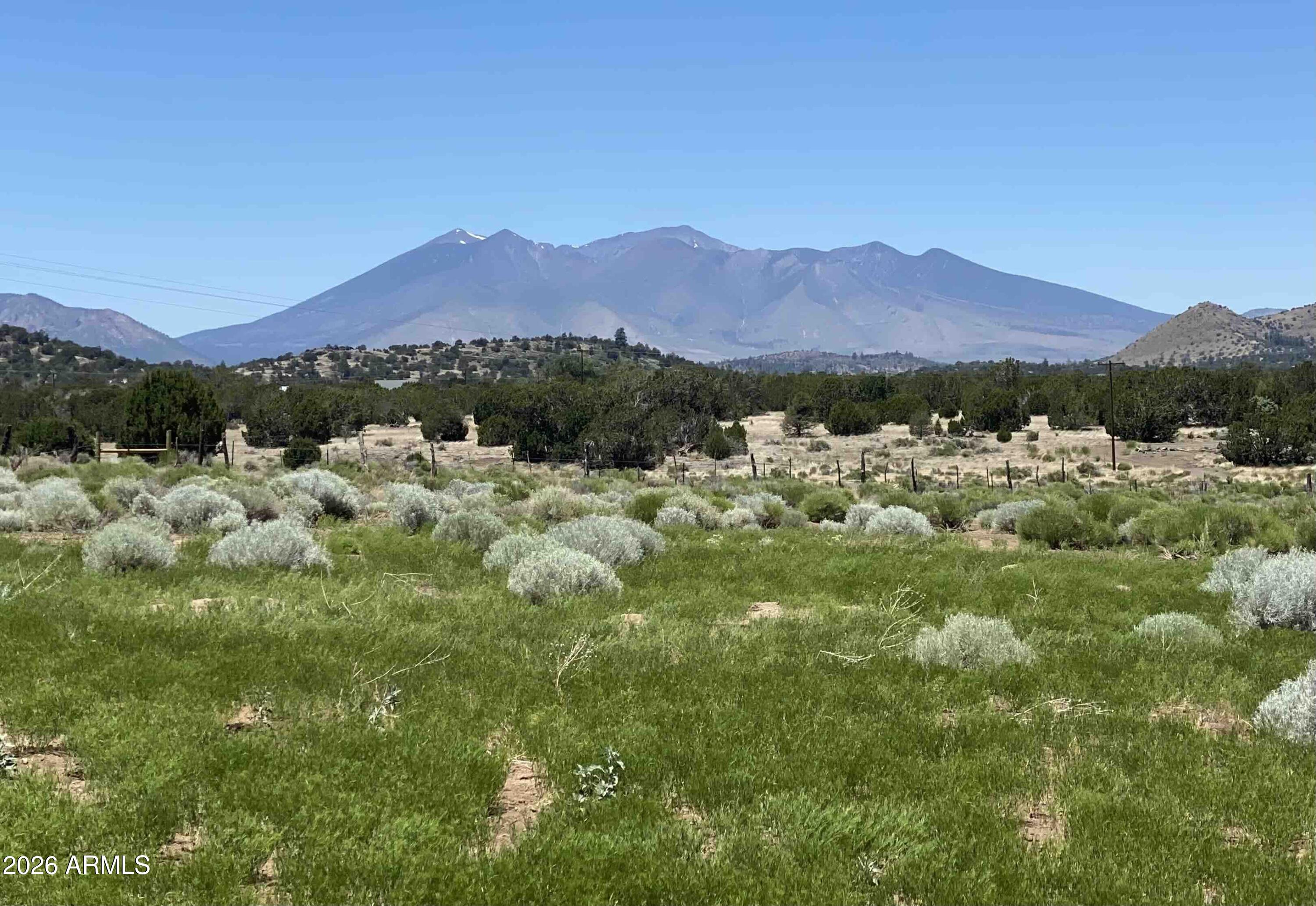 6570 Meadows Lane Flagstaff, AZ 86004 - Photo 42 of 66 a view of a town with mountains in the background