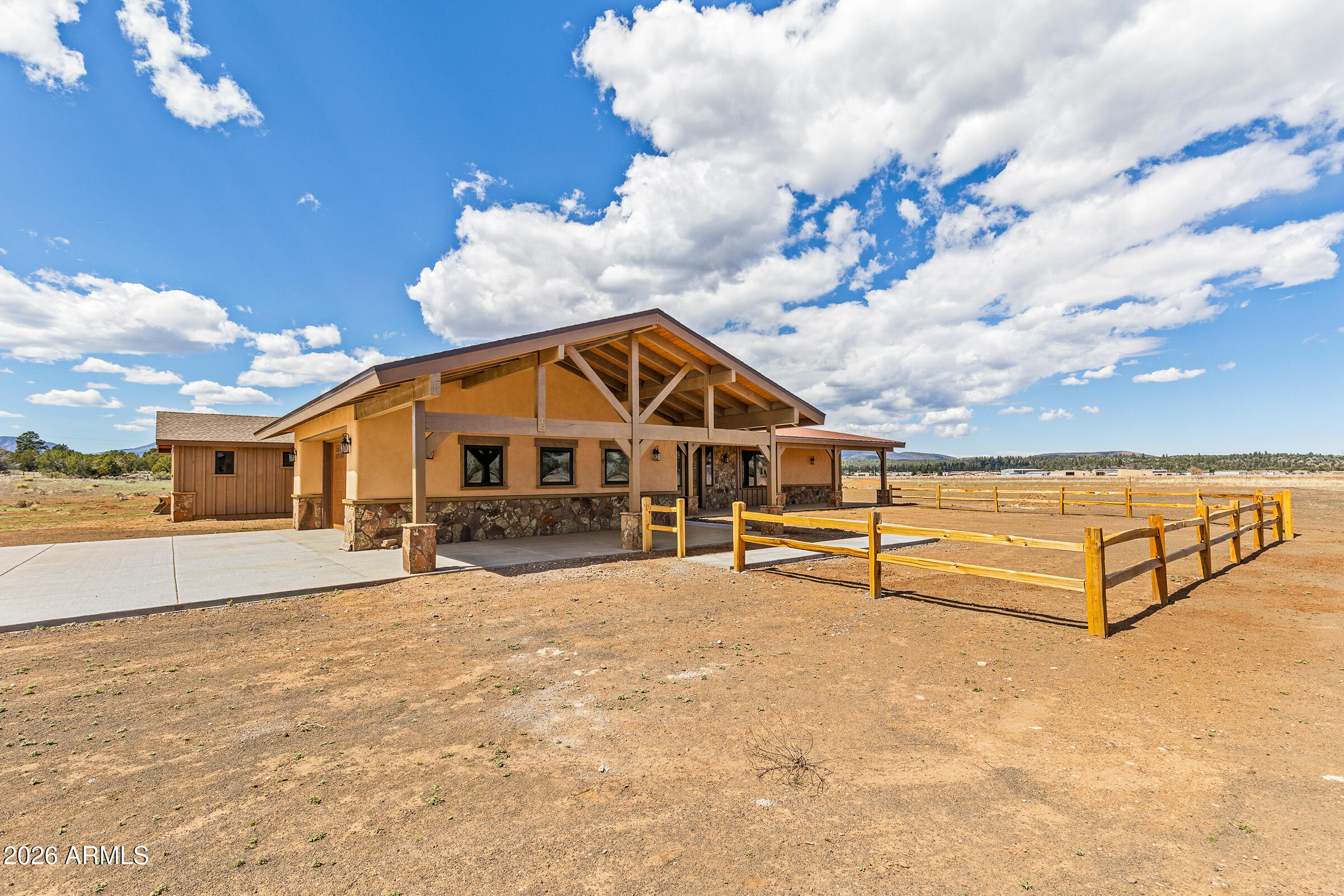 6570 Meadows Lane Flagstaff, AZ 86004 - Photo 5 of 66 a view of a house with swimming pool and sitting area