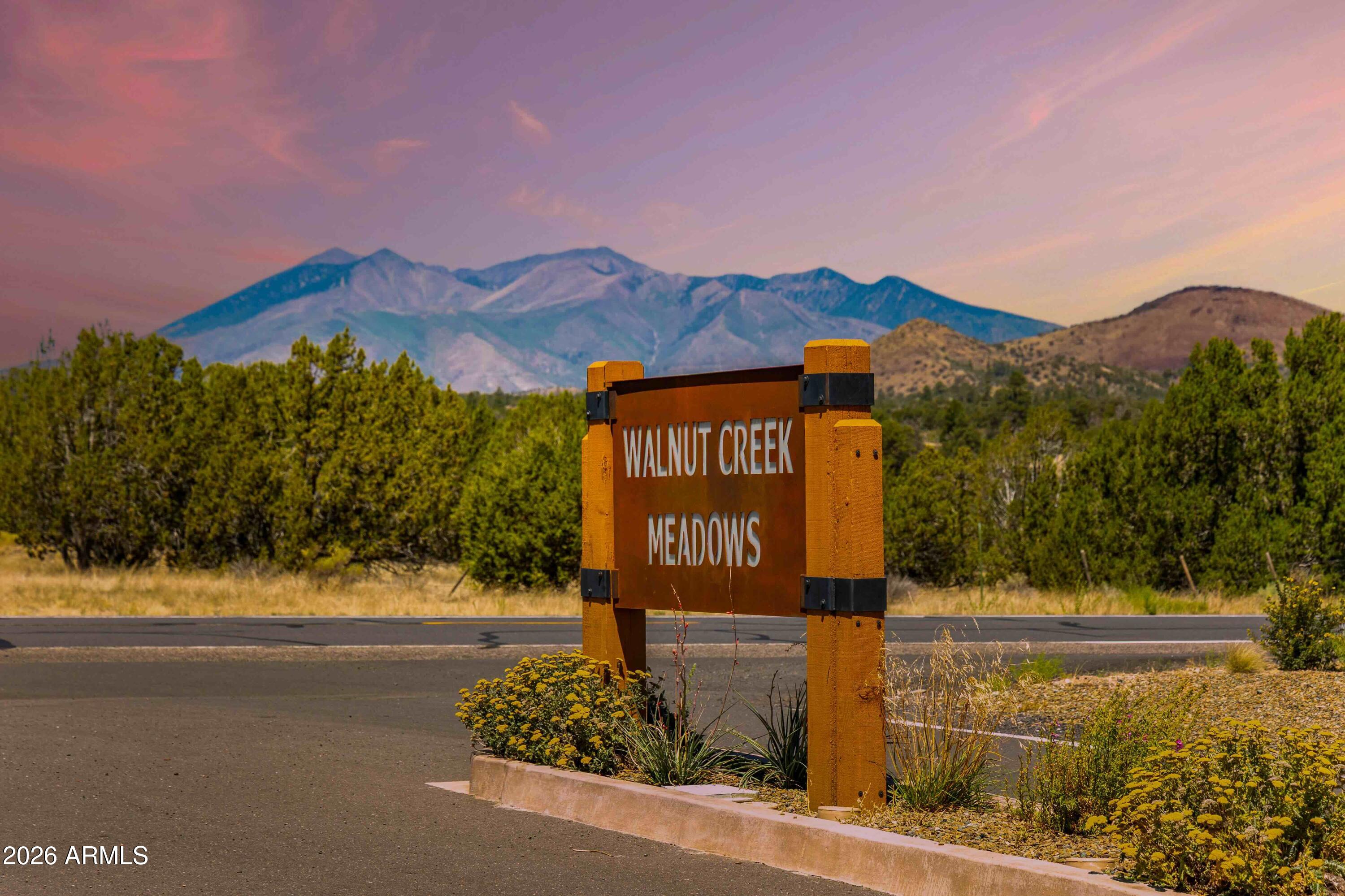 6570 Meadows Lane Flagstaff, AZ 86004 - Photo 57 of 66 a sign board with a house in the background