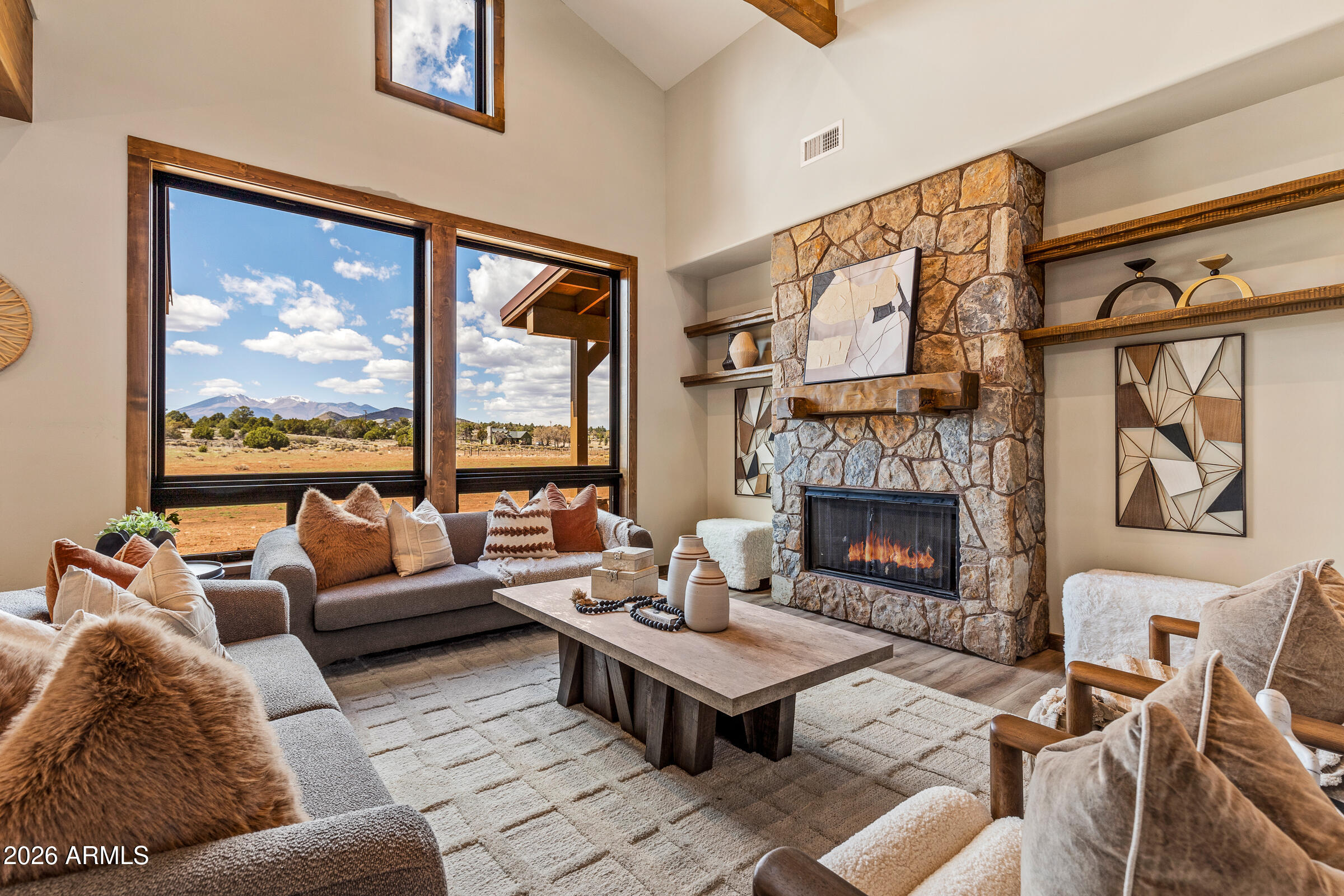 6570 Meadows Lane Flagstaff, AZ 86004 - Photo 8 of 66 a living room with fireplace furniture and a large window