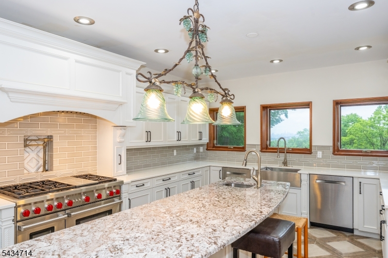 50 Rock Spring Road West Orange, NJ 07052 - Photo 14 of 50 a kitchen with stainless steel appliances granite countertop a stove and a sink
