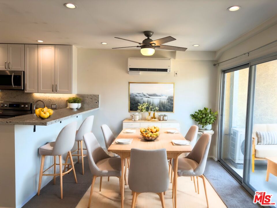 1731 Colby Avenue, Unit 202 Los Angeles, CA 90025 - Photo 4 of 7 a dining room with furniture a livingroom view and wooden floor