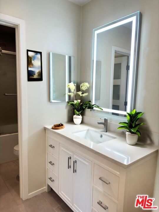 1731 Colby Avenue, Unit 202 Los Angeles, CA 90025 - Photo 7 of 7 a bathroom with a sink and a mirror