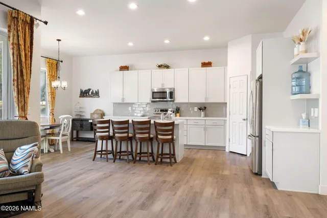a bathroom with a double vanity sink mirror and shower