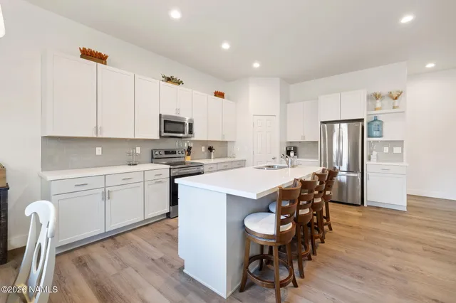 a bathroom with a sink a toilet and a bathtub