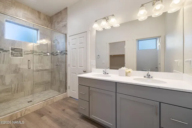 a white toilet sitting next to a bath tub and a shower