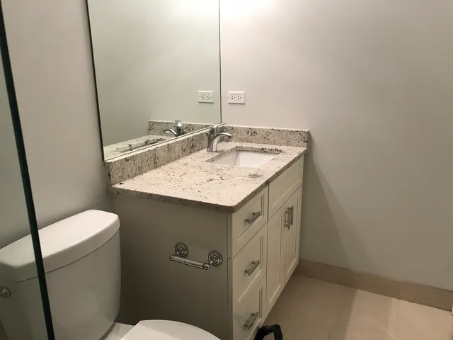 a bathroom with a sink and mirror