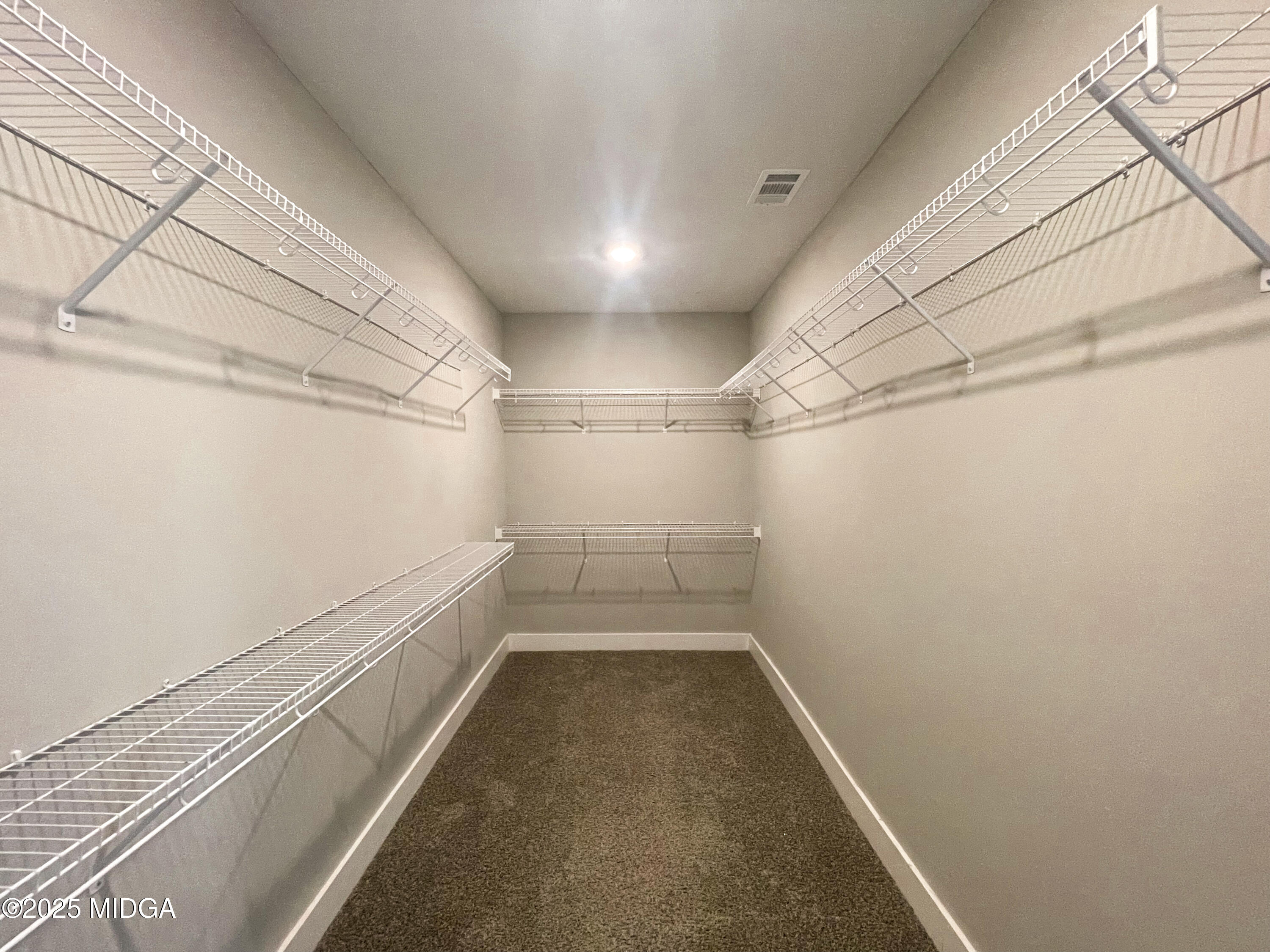 113 Perth Court Warner Robins, GA 31088 - Photo 16 of 28 a view of a room with racks on the wall