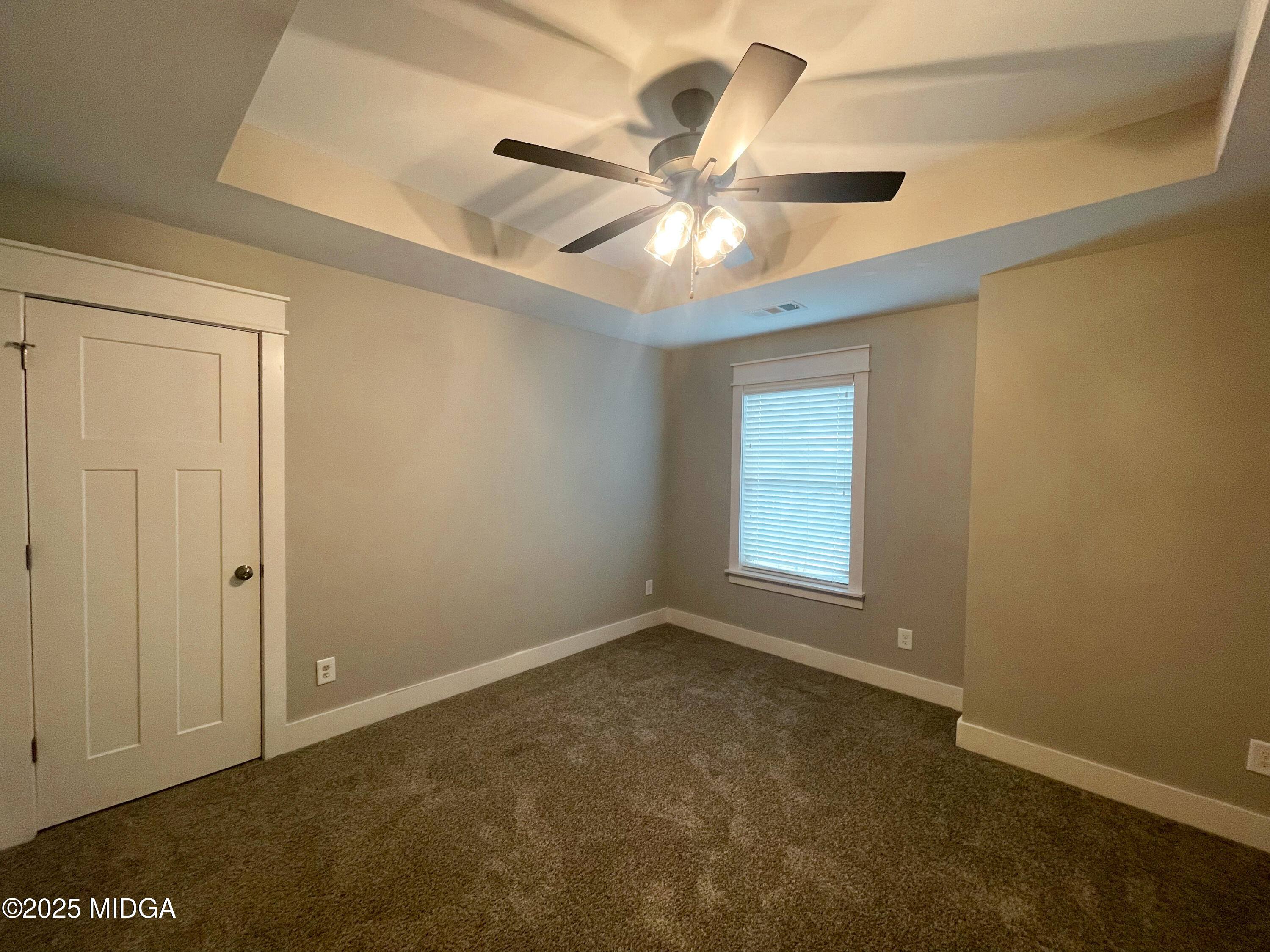 113 Perth Court Warner Robins, GA 31088 - Photo 20 of 28 an empty room with windows and fan