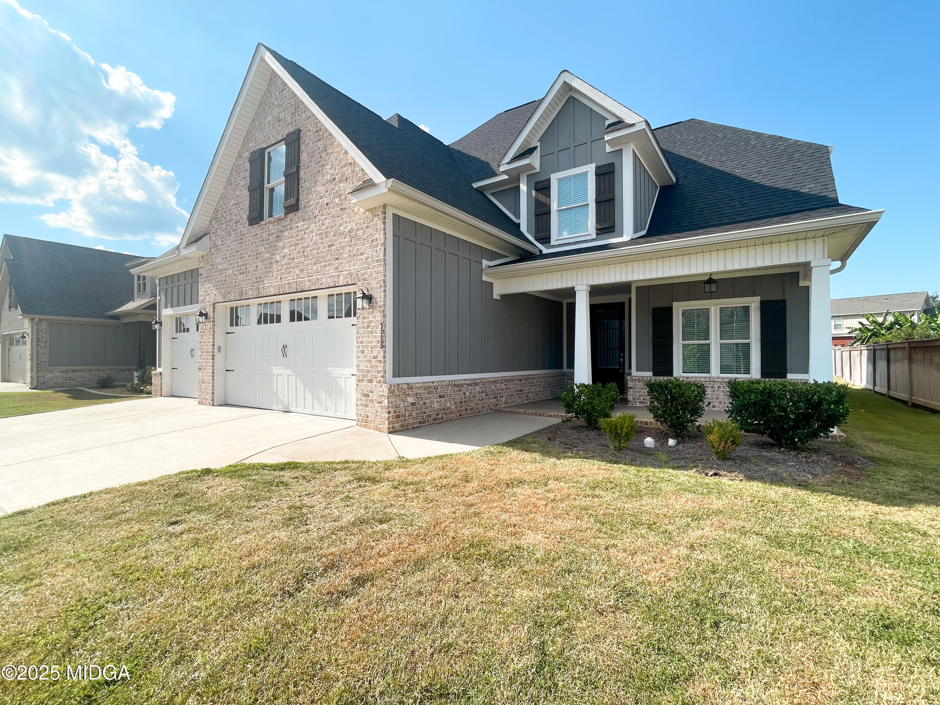113 Perth Court Warner Robins, GA 31088 - Photo 2 of 28 a front view of a house with a yard