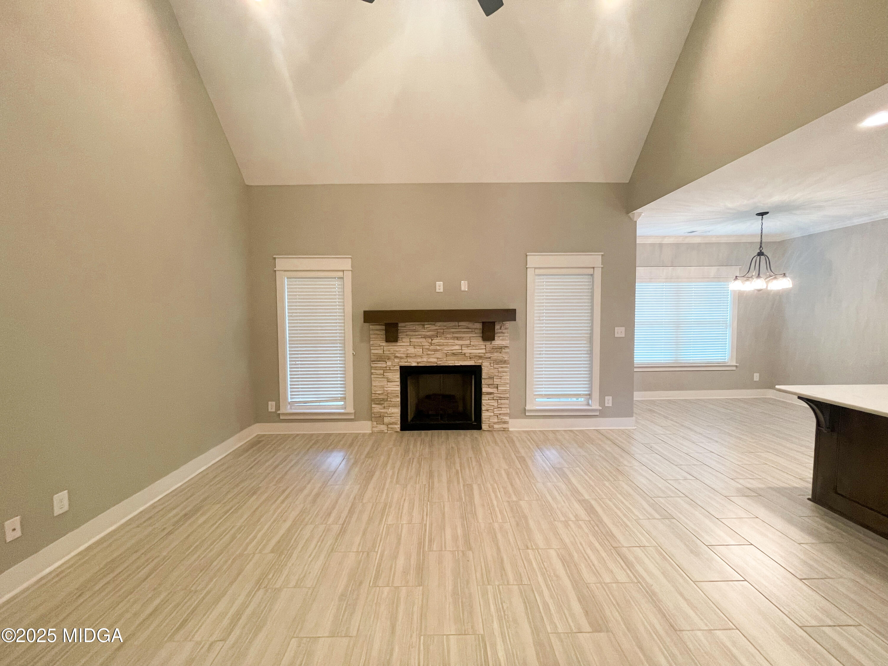 113 Perth Court Warner Robins, GA 31088 - Photo 3 of 28 a view of a livingroom with wooden floor and a fireplace