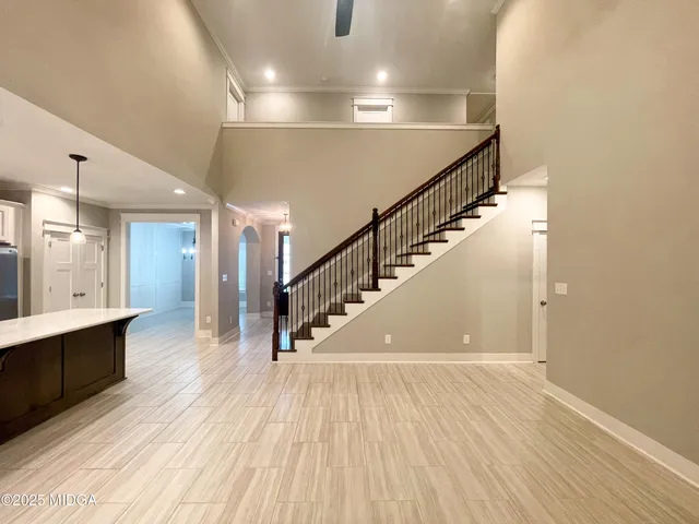 a view of entryway and hall with wooden floor