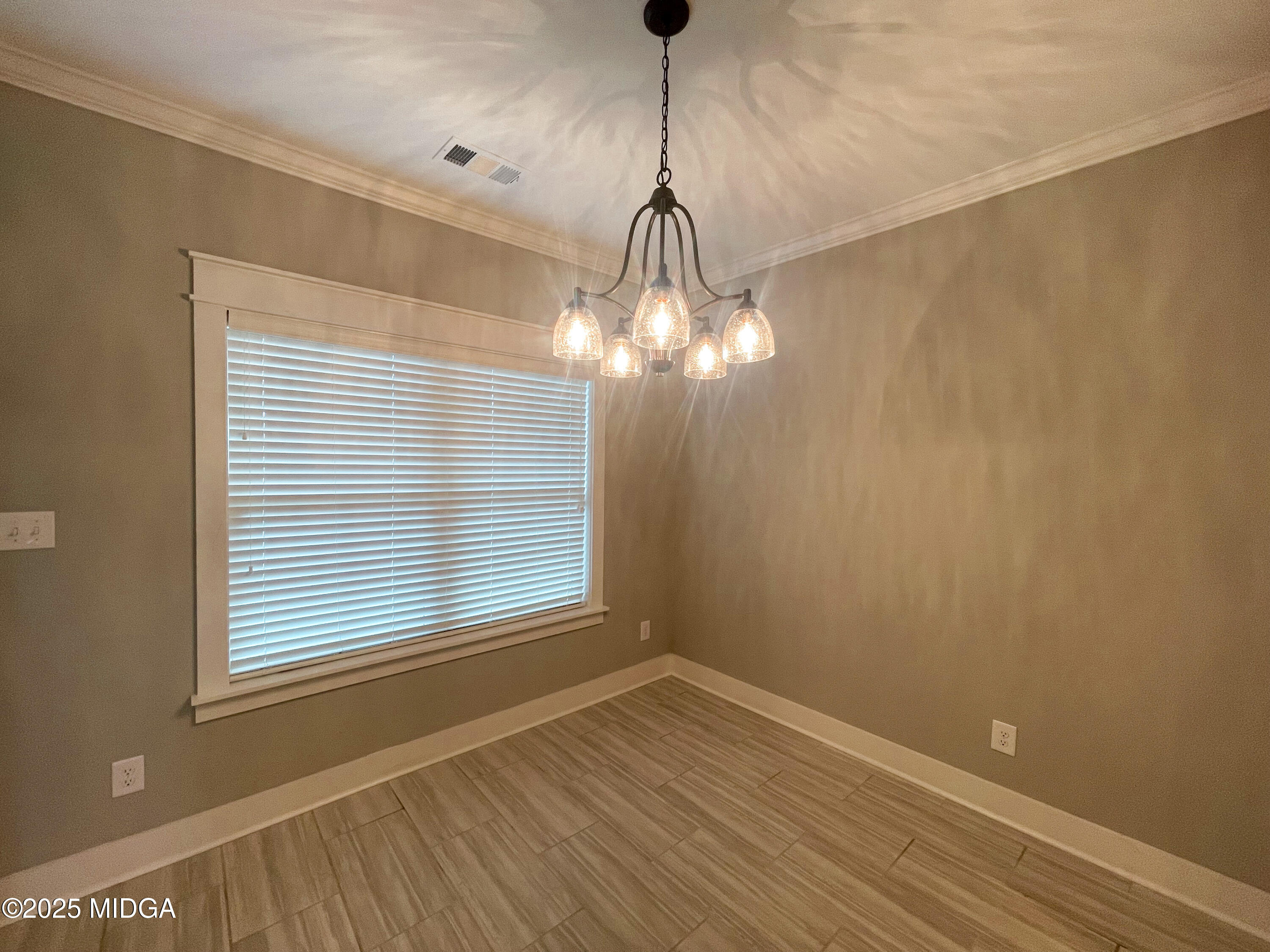 113 Perth Court Warner Robins, GA 31088 - Photo 6 of 28 a view of empty room with wooden floor and fan