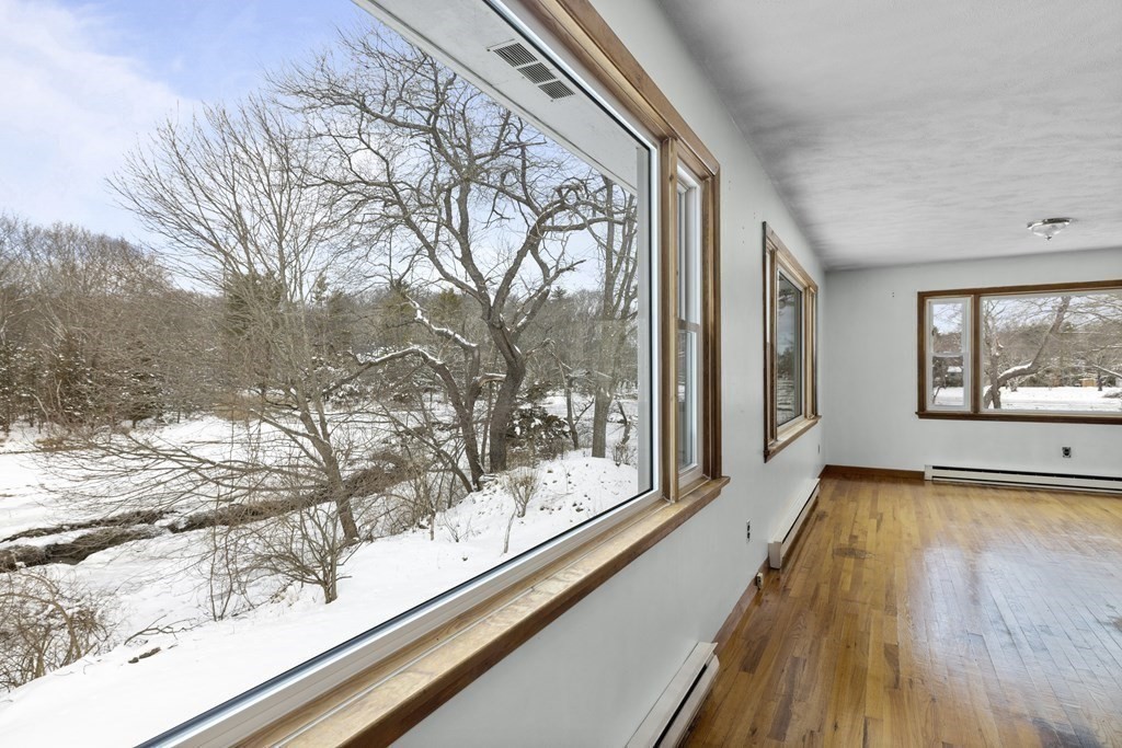 44 Sumner Street Gloucester, MA 01930 - Photo 14 of 40 a view of a room with wooden floor and a large window