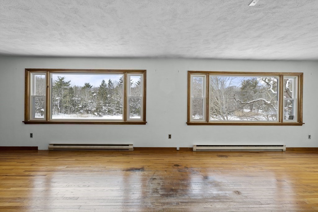 44 Sumner Street Gloucester, MA 01930 - Photo 17 of 40 a view of room with window and wooden floor