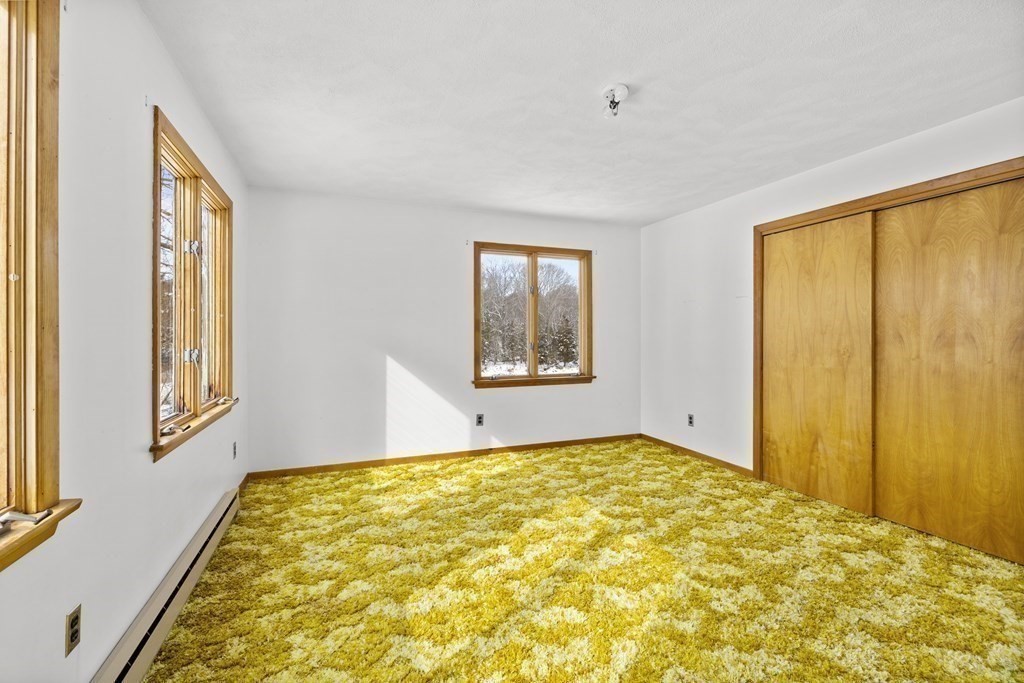 44 Sumner Street Gloucester, MA 01930 - Photo 22 of 40 a bedroom with a bed and a window