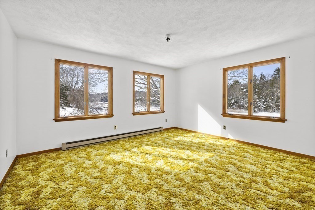 44 Sumner Street Gloucester, MA 01930 - Photo 24 of 40 a view of an empty room with a window