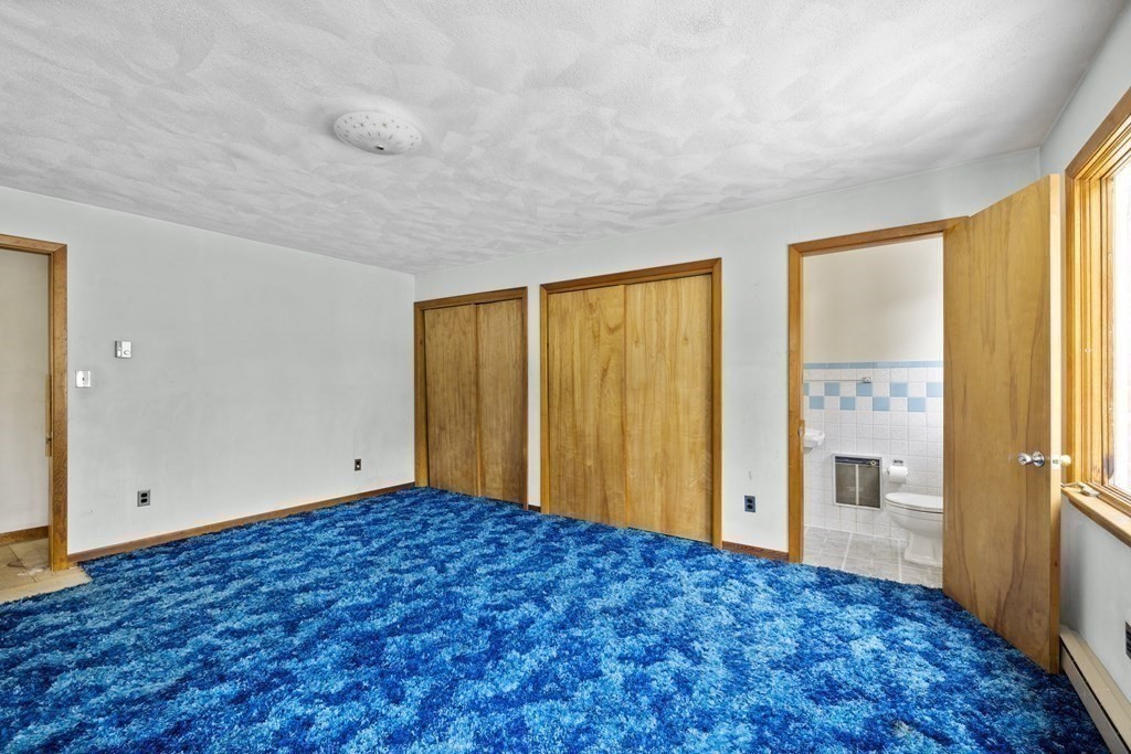 44 Sumner Street Gloucester, MA 01930 - Photo 27 of 40 a view of an empty room with window and wooden floor