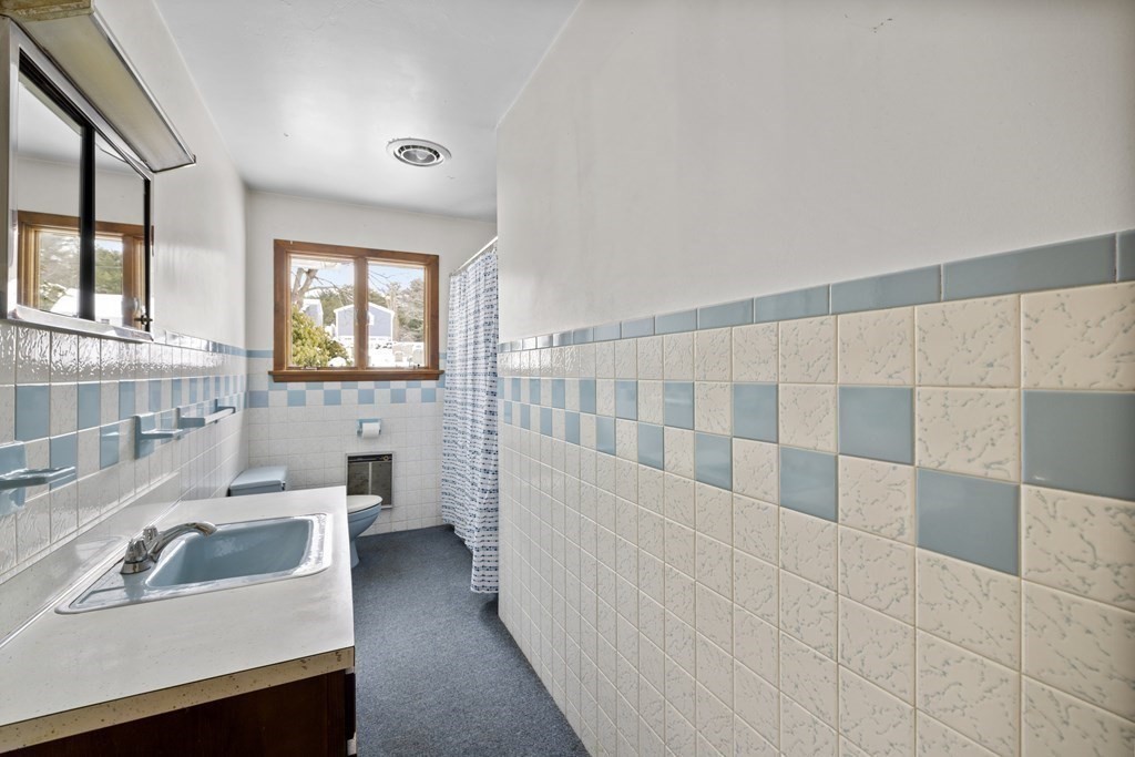 44 Sumner Street Gloucester, MA 01930 - Photo 28 of 40 a bathroom with a sink and a bathtub