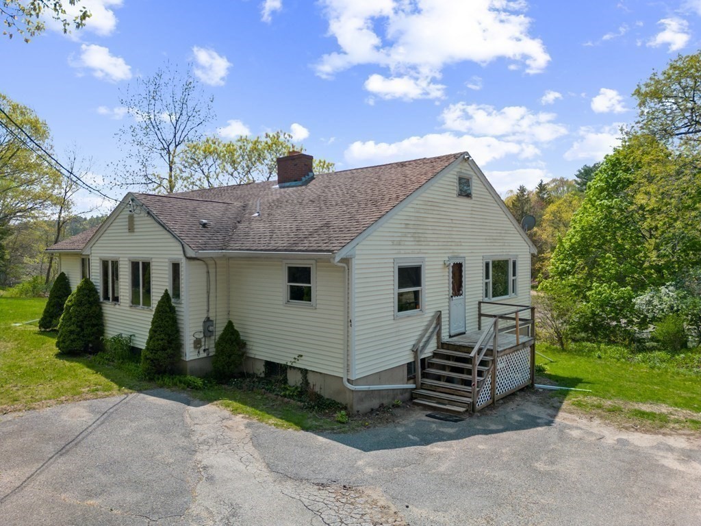 44 Sumner Street Gloucester, MA 01930 - Photo 3 of 40 a view of a house with a yard