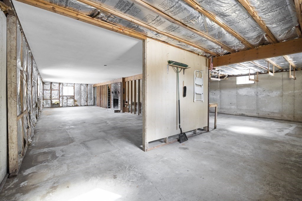 44 Sumner Street Gloucester, MA 01930 - Photo 34 of 40 a view of a hallway with wooden walls