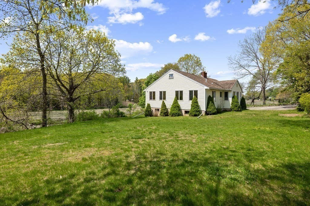 44 Sumner Street Gloucester, MA 01930 - Photo 36 of 40 a front view of a house with a yard