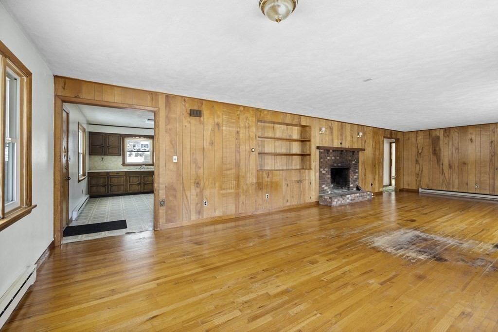 44 Sumner Street Gloucester, MA 01930 - Photo 8 of 40 a view of empty room with wooden floor and fan