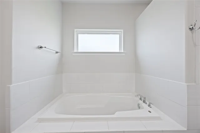 a close up view of a bathtub in a bathroom
