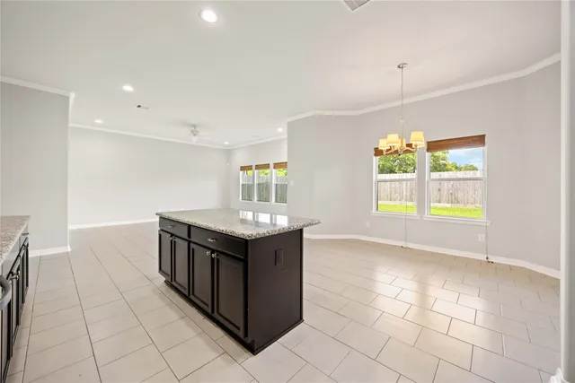 a kitchen with stainless steel appliances granite countertop a sink and a stove