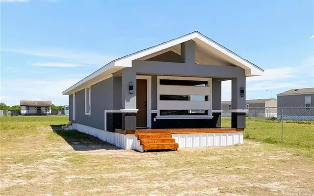 a view of a kitchen with a sink and microwave