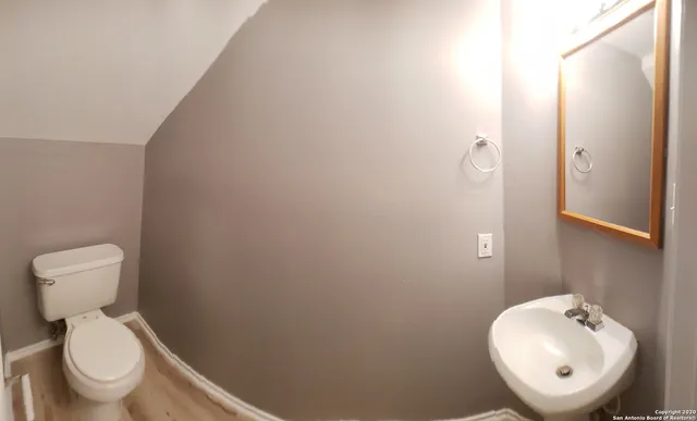 a bathroom with a toilet and a sink