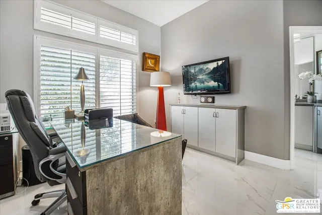 a view of a workspace with furniture