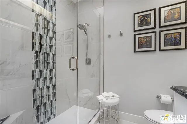 a bathroom with a toilet and shower