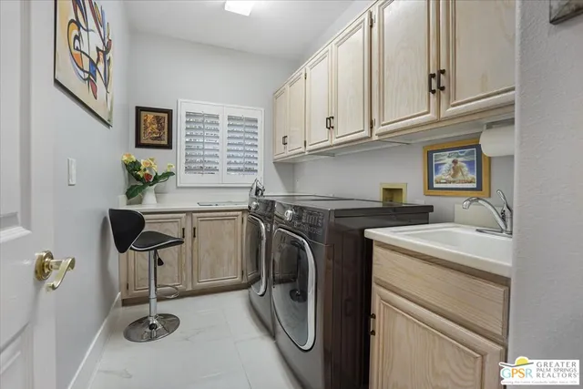 a utility room with closet dryer and washer