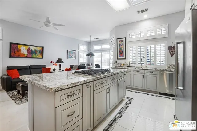 a kitchen with a sink stove and refrigerator