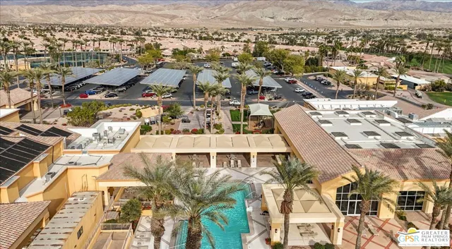 a view of parking garage with cars parked