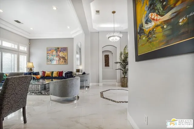 a room with furniture and painting on the wall