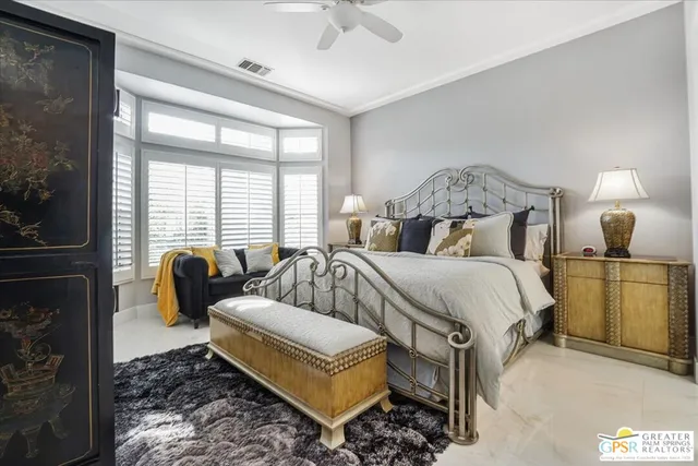 a bedroom with bed and a window