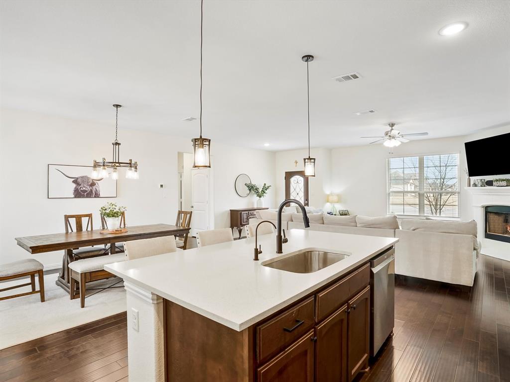 173 Mdw Vista Drive Rhome, TX 76078 - Photo 12 of 40 a kitchen with sink a microwave and living room view
