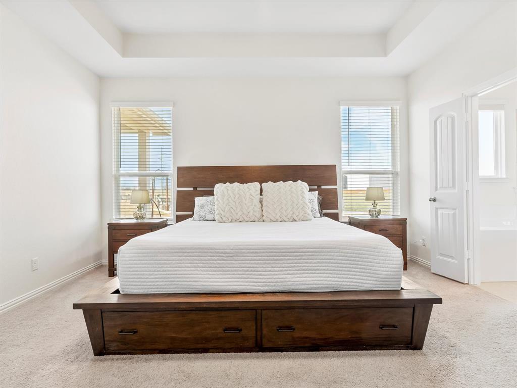 173 Mdw Vista Drive Rhome, TX 76078 - Photo 15 of 40 a bedroom with a bed and window