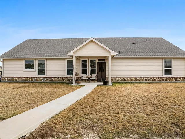 a front view of a house with yard