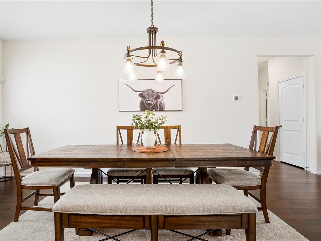 173 Mdw Vista Drive Rhome, TX 76078 - Photo 8 of 40 a view of a dining room with furniture and wooden floor