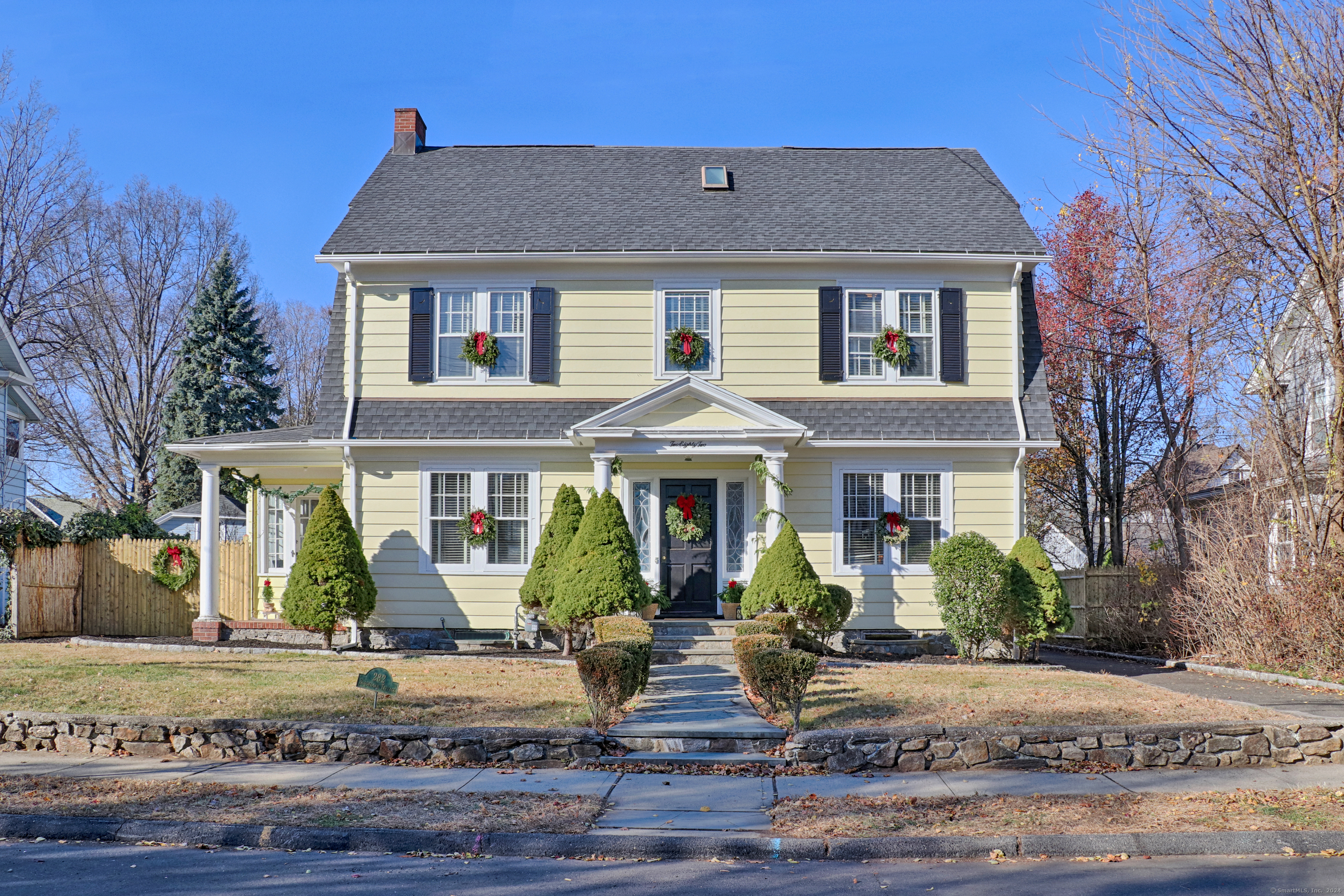 282 Brooklawn Terrace Fairfield, CT 06825 - Photo 1 of 1 a front view of a house with garden