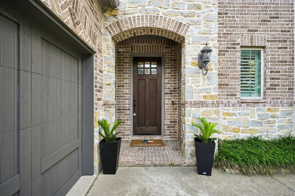 2029 Temperate Drive Allen, TX 75013 - Photo 3 of 40 a front view of a house with potted plants
