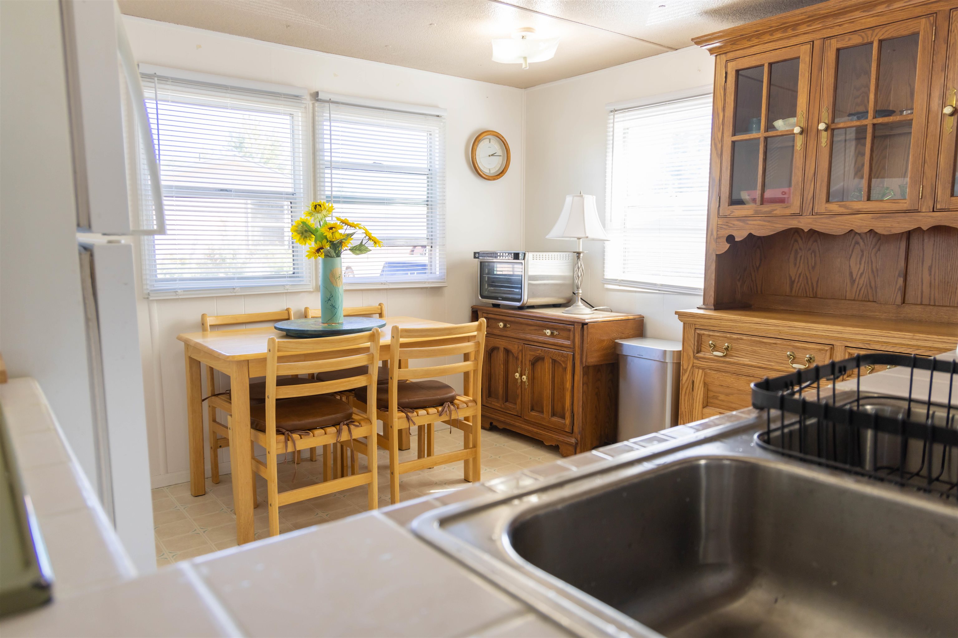 585-25 25 1/2 Road, Unit 232 Grand Junction, CO 81505 - Photo 12 of 40 a kitchen with stainless steel appliances a stove a sink and a microwave