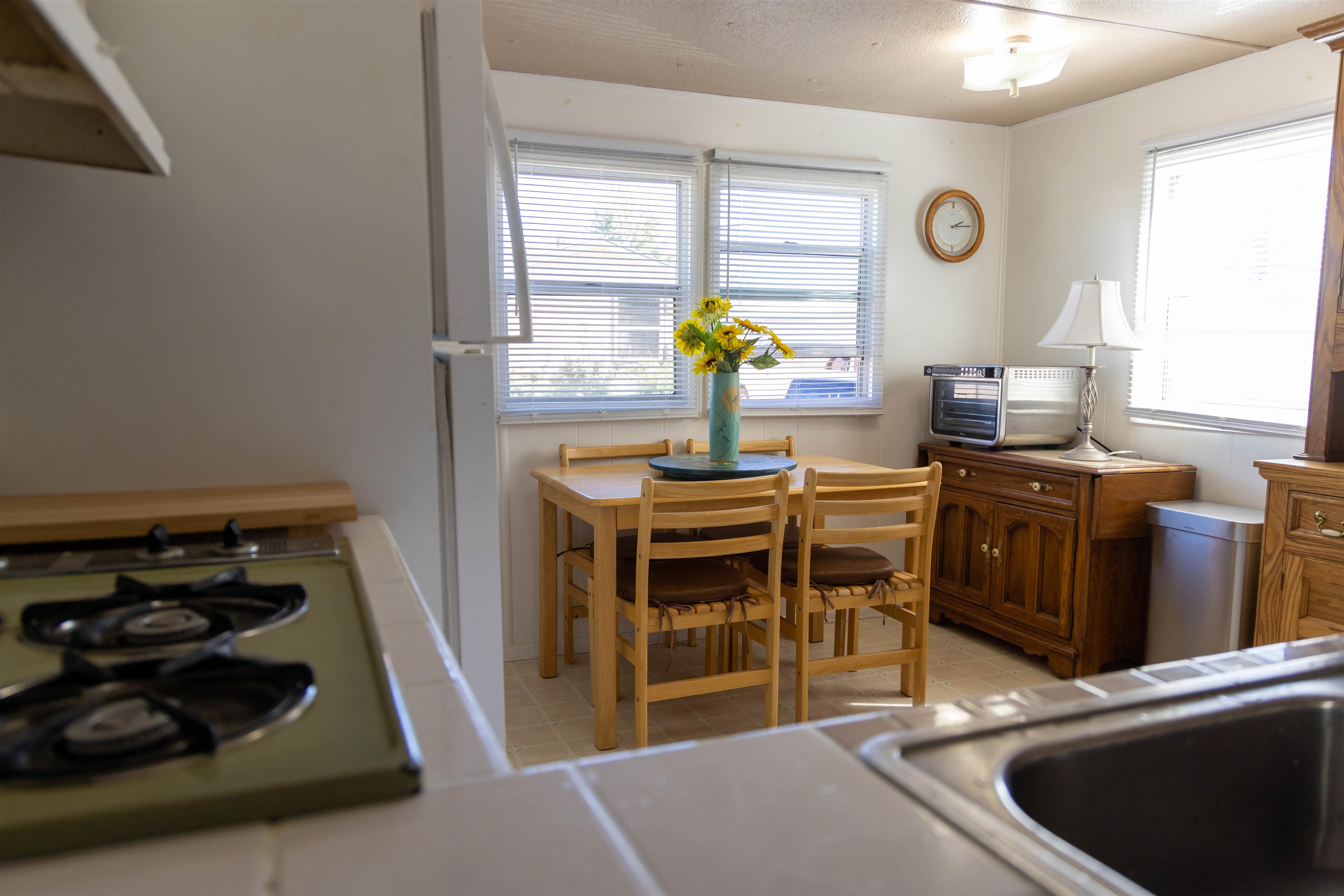 585-25 25 1/2 Road, Unit 232 Grand Junction, CO 81505 - Photo 13 of 40 a kitchen with stainless steel appliances granite countertop a stove a sink and a microwave